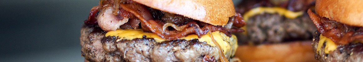 Eating Burger at Burgermaster restaurant in Seattle, WA.